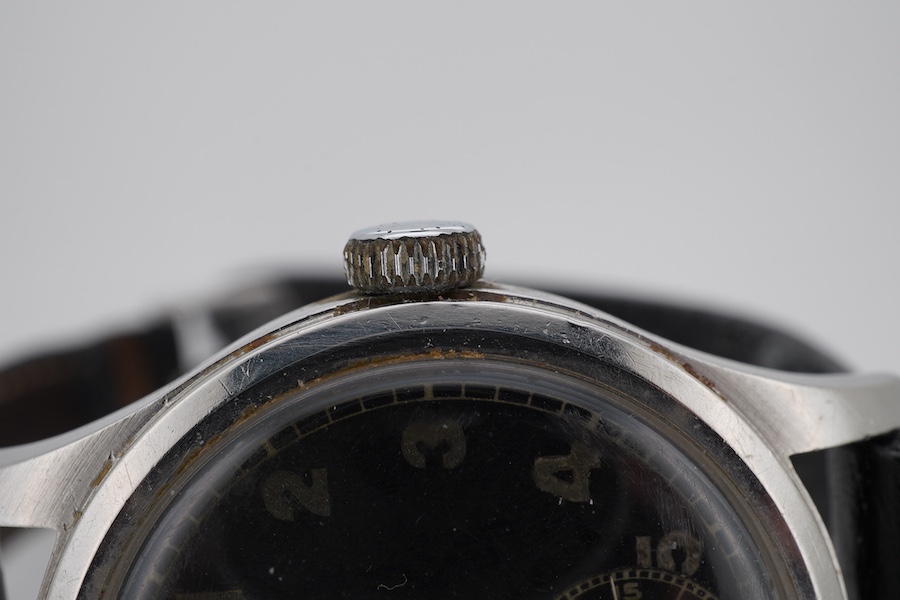 A gentleman's mid 20th century steel Mimo manual wind wrist watch, with black Arabic dial and subsidiary seconds, case diameter 35mm, on a later associated leather strap.